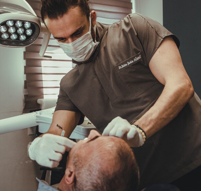 a dentist examining a patient